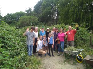 Volunteers posing for a group photo after clearing the path